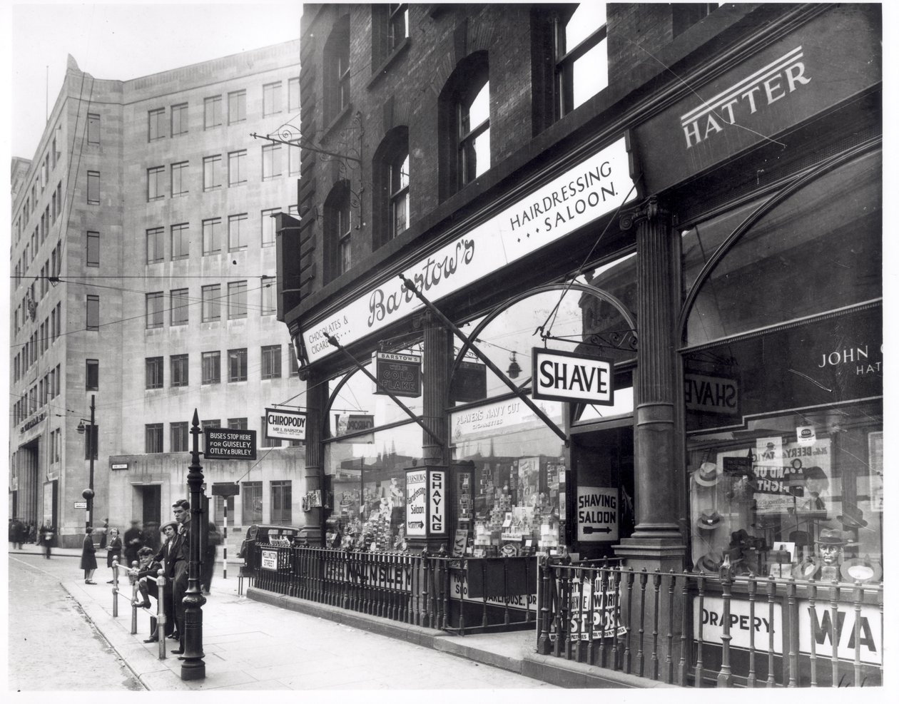 Barstows Barbershop on Wellington Street, Leeds, 1939 by English Photographer