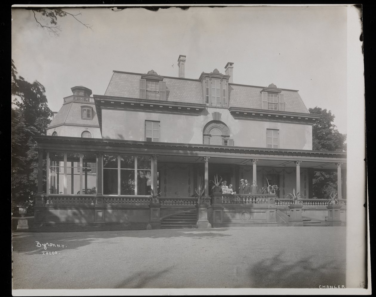 People standing on the porch of the Astor Chanler residence at Barrytown, New York, 1907 by Byron Company