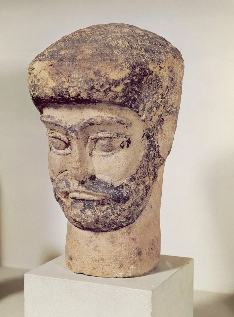 Head of a beaded man by Elamite