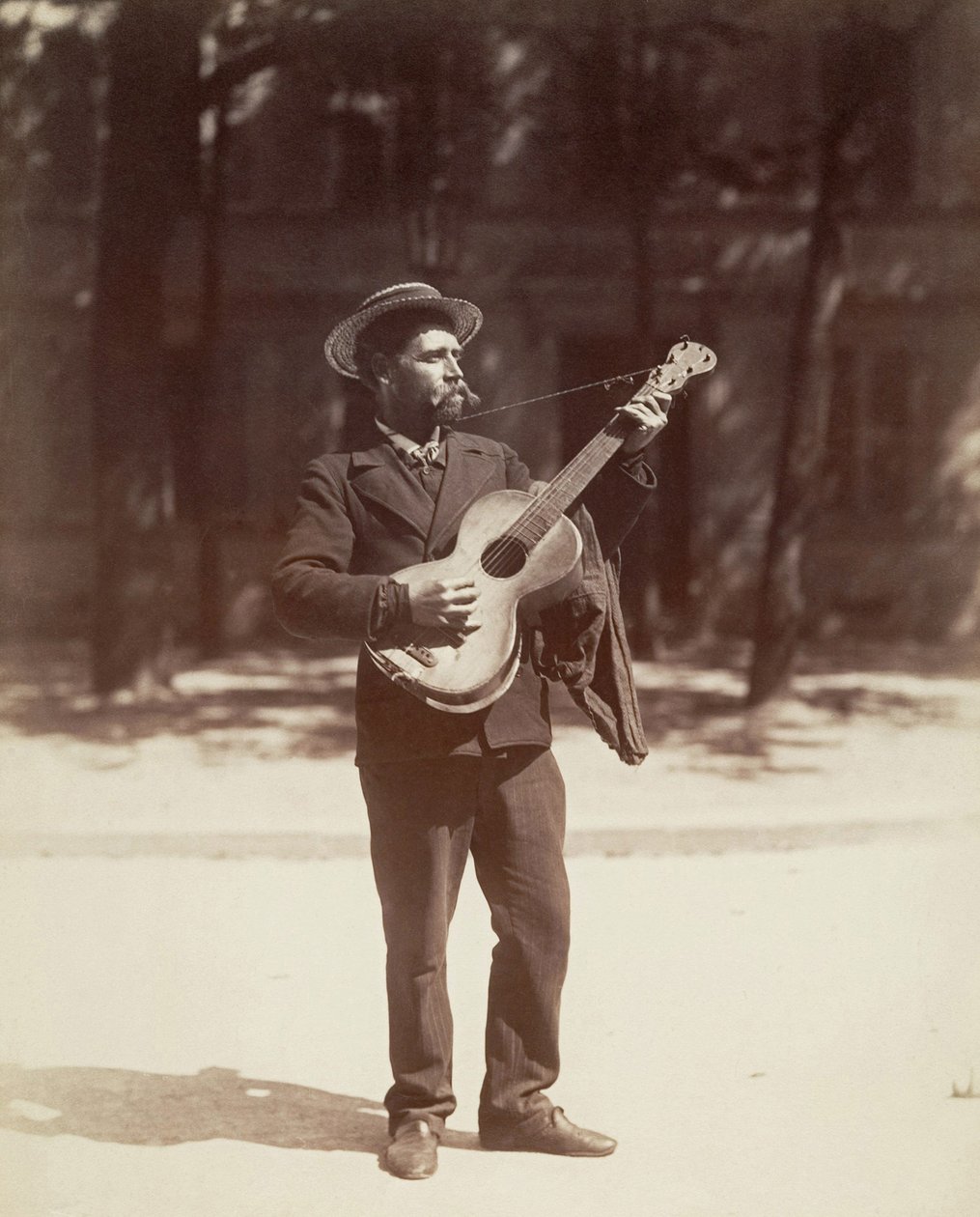 Guitar player, Paris by Eugène Atget