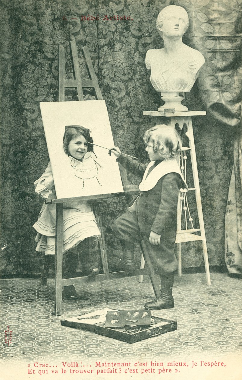 Children painting, girl with head through canvas by French Photographer