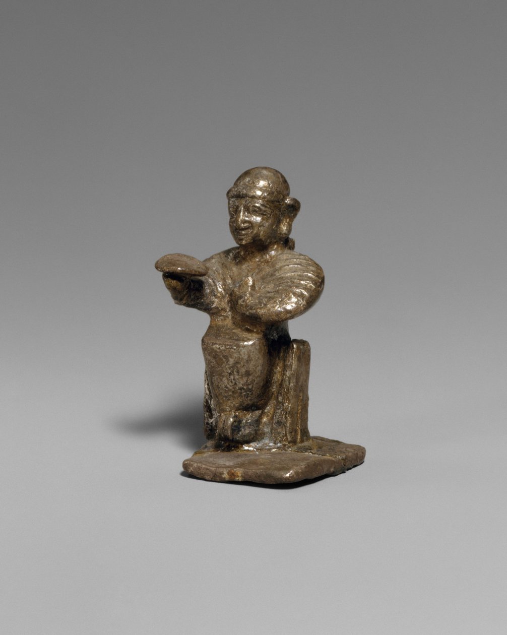 Seated female by Hittite