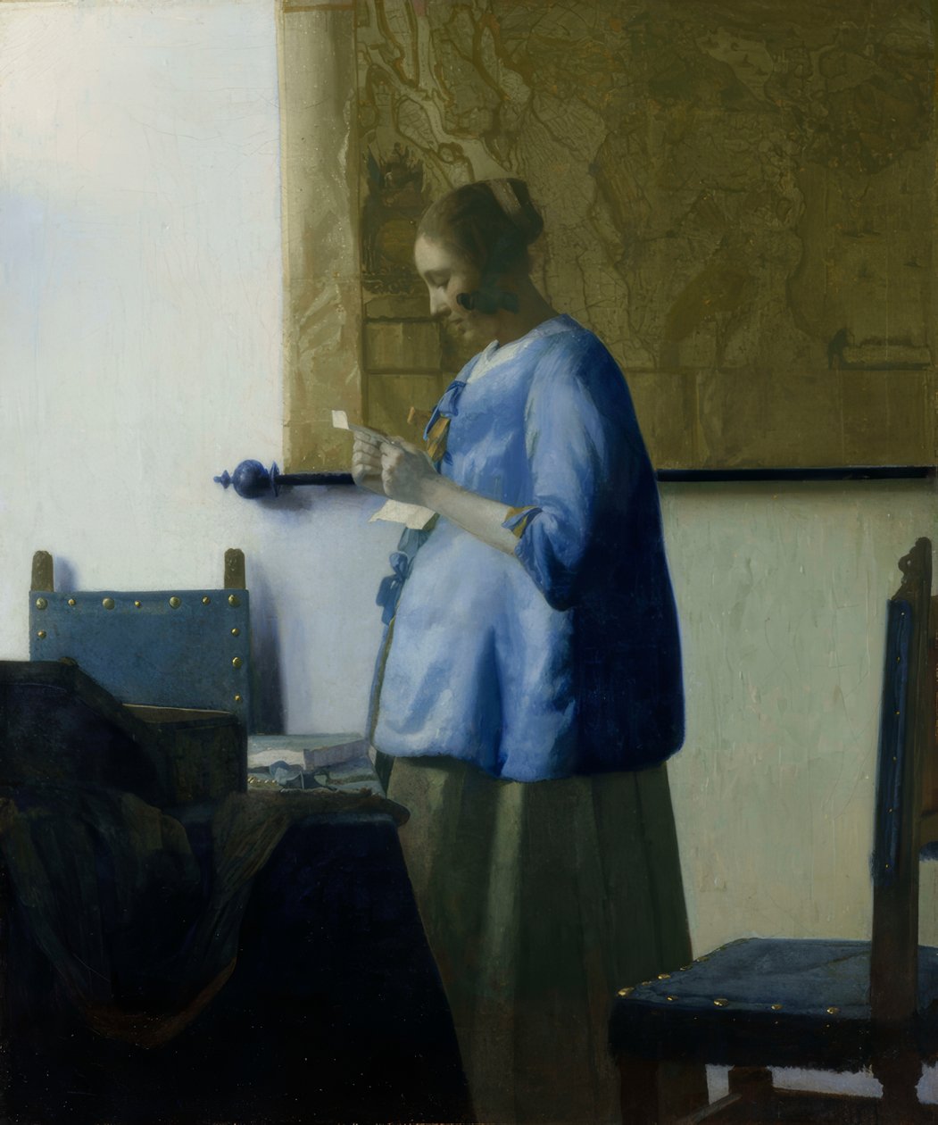 Woman Reading a Letter in Blue by Jan Vermeer van Delft