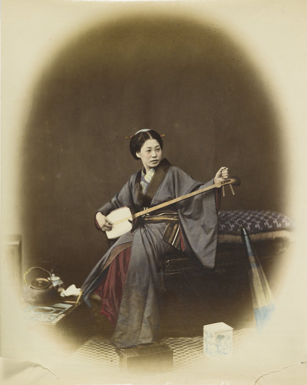 Woman playing the shamisen by Japanese Photographer