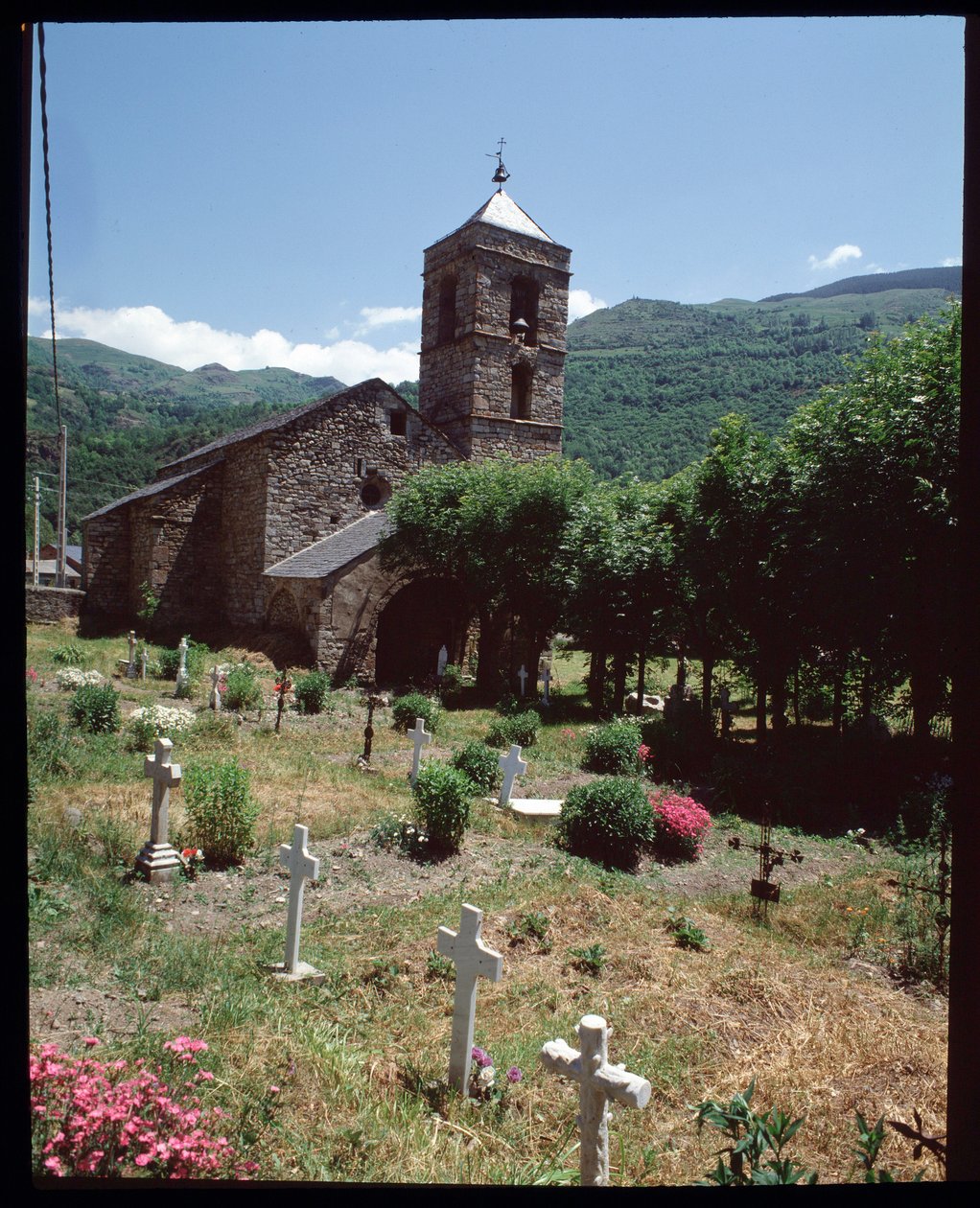 View of the church and cemetery by Romanesque