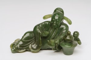 Recumbent Chinese scholar figure