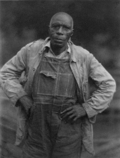 Man in Overalls by American Photographer
