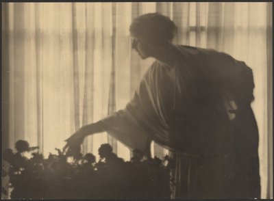 Woman Tending Flowers Inside Her Apartment by Arthur F. Kales