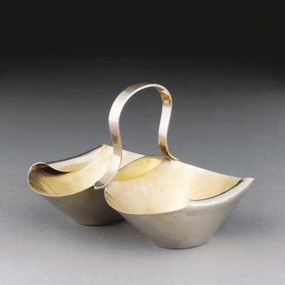 A White Metal Basket by Christopher Dresser