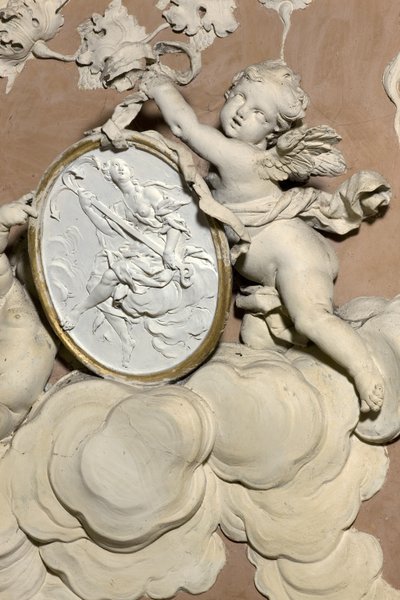 Angels holding a medallion by Diego Carloni