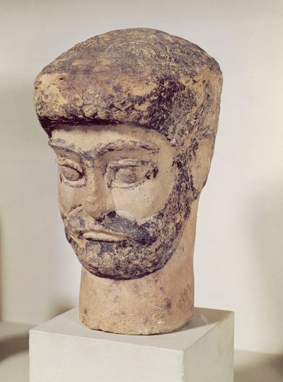 Head of a beaded man by Elamite