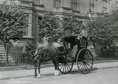 A Driver Sitting on His Hansom Cab by English Photographer