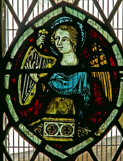 Window depicting an angel playing a harp by English School