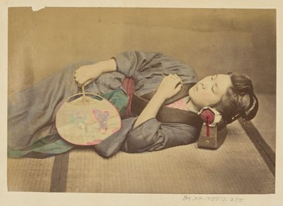 Sleeping Japanese woman holding a fan by Felice Beato