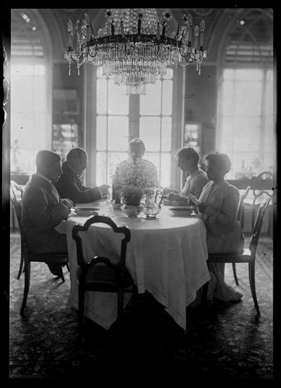 Family Mautner at Eating by Ferdinand Schmutzer