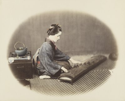 Woman playing a koto by Japanese Photographer