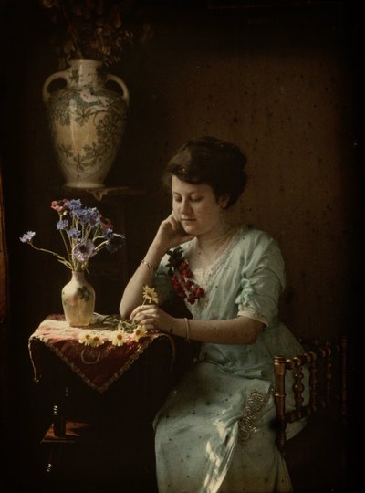 Woman with flowers by Johannes Hendrikus Antonius Maria Lutz