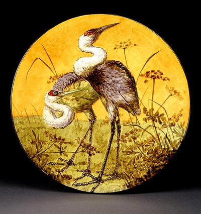 Charger depicting two cranes by John Bennett