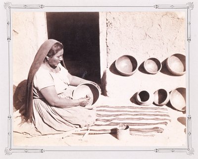 Woman Polishing Pottery by John K. Hillers