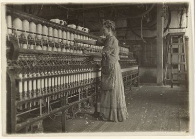 In an Old-Fashioned Textile Mill (Spinner) by Lewis W. Hine