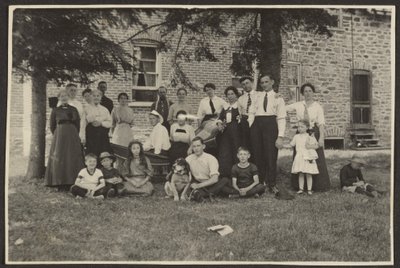 Group Portrait Outside Building by Louis Fleckenstein