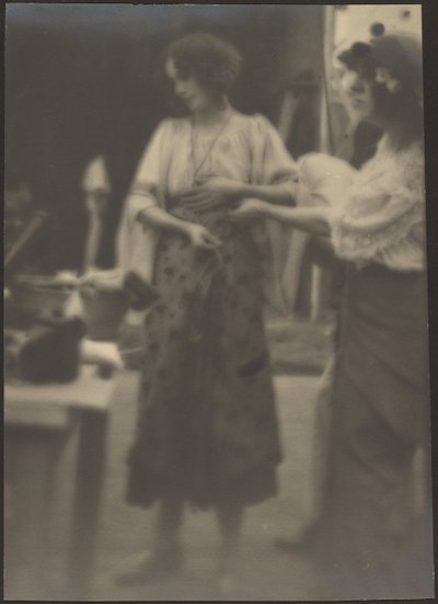 Two Women Standing in Studio by Louis Fleckenstein