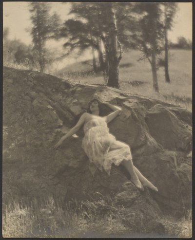 Woman Reclining on Rock Outcrop by Louis Fleckenstein