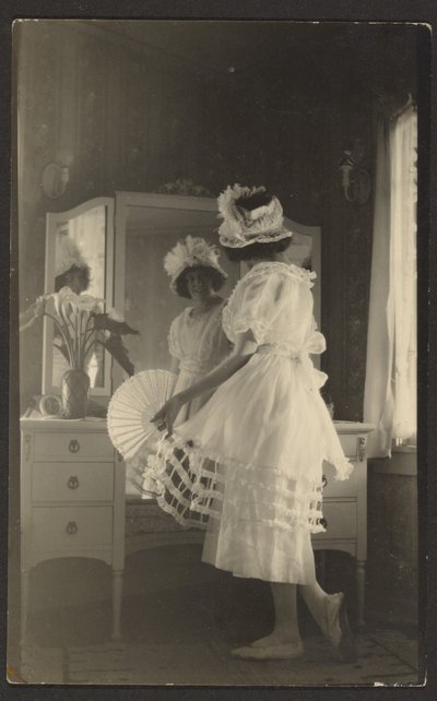 Woman at Mirror with Fan by Louis Fleckenstein