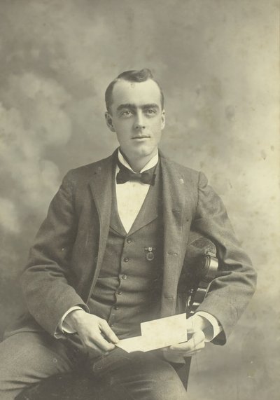 Untitled Portrait of Seated Man by Thompson Studio