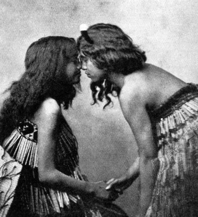 Maori girls rubbing noses by Unbekannt
