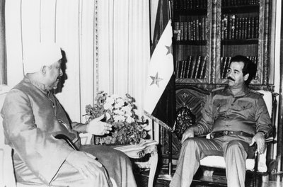 Saddam Hussein at a meeting, Iraq by Unbekannt