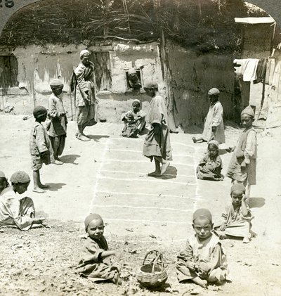 Children playing hopscotch, Kashmir, India by Underwood and Underwood