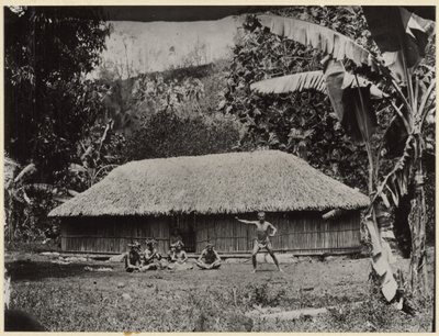 Man Posed in Front of Hut by Unknown artist