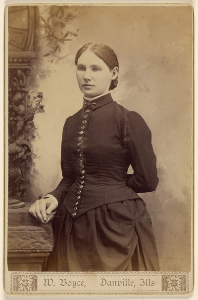 Unidentified woman, standing by W. Boyce